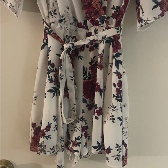 Floral Wrap Shorts Romper with Belt by Charlotte Russe. - Picture 4 of 7